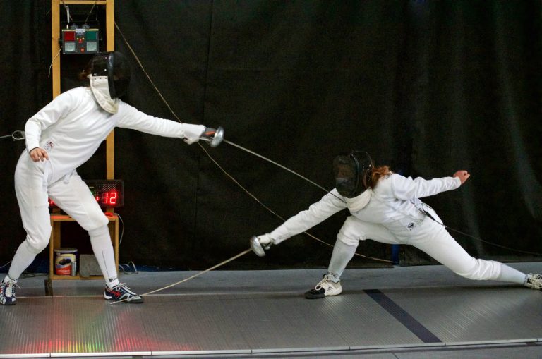 Sophia (L) wins the Women's Epee event at the SITS C & Under (April 2021)